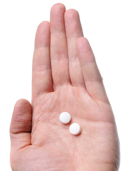 Hand holding pills — Stock Photo, Image