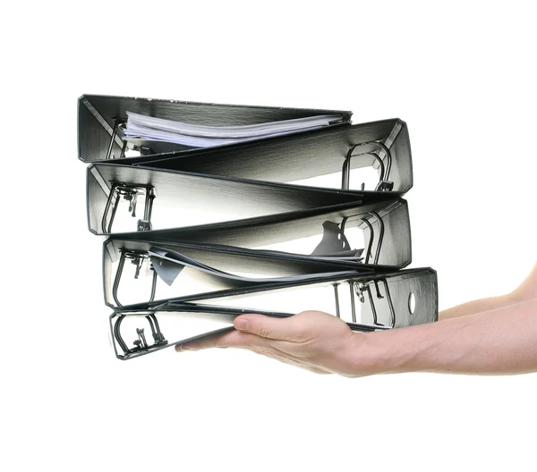 Hands passing a pile of ring binders — Stock Photo, Image