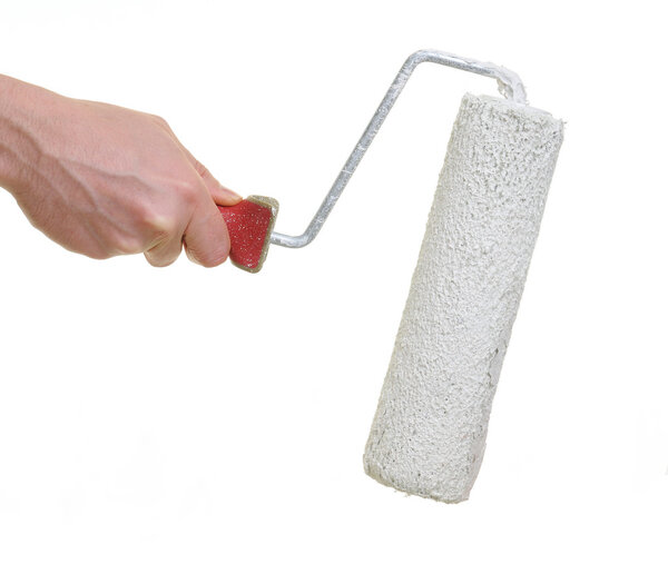 Hand holding paint roller