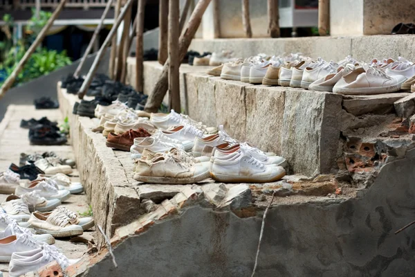 stock image Many shoes on stairs