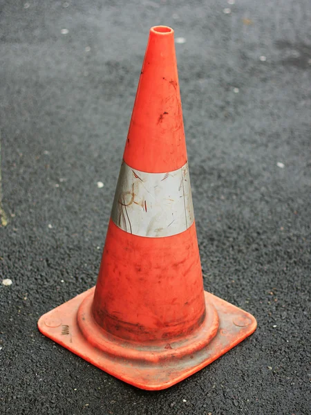 Orange traffic cone placed in city street — Stock Photo, Image