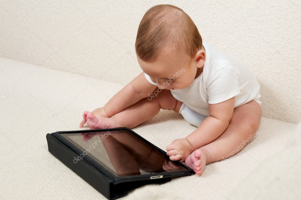 Baby with a small computer