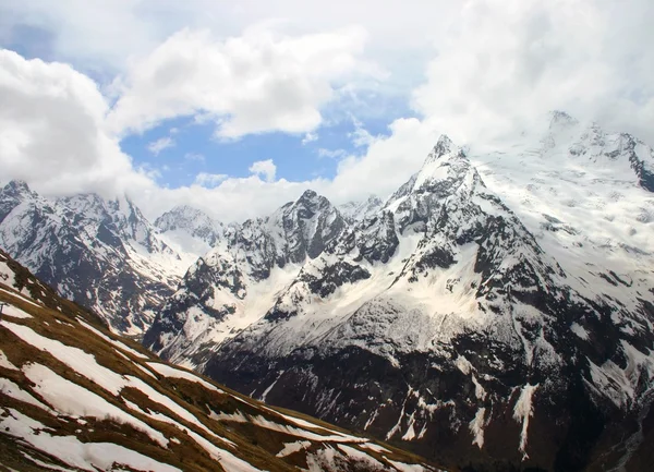 stock image Snow mountain Dombai and blue sky