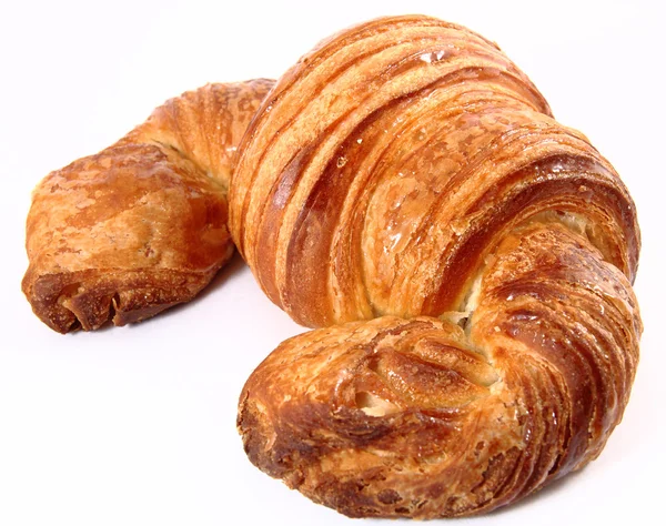 Croissant em um fundo branco — Fotografia de Stock