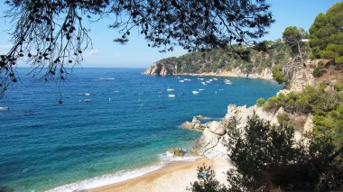 Tranquil beach in Catalonia clipart