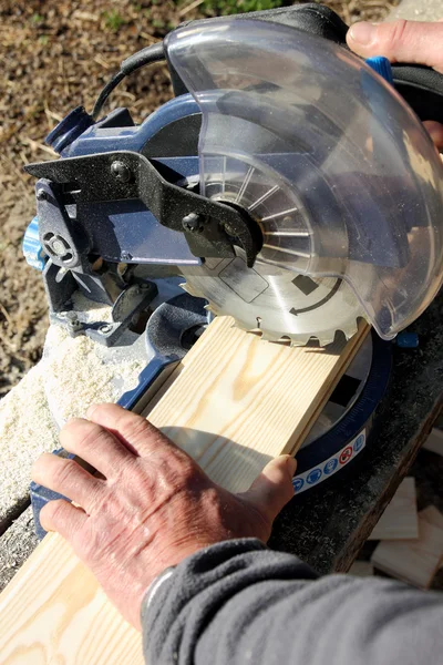 Circular Saw Cutting a Wood Plank — Stock Photo, Image