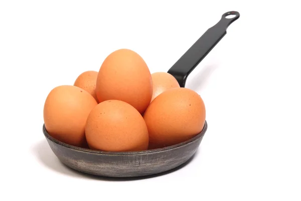 Seis huevos en una sartén negra — Foto de Stock