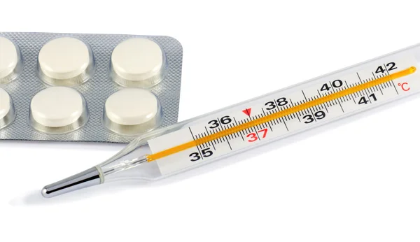 Termometro clinico e pillole — Foto Stock