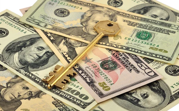 Gouden sleutel en geld — Stockfoto