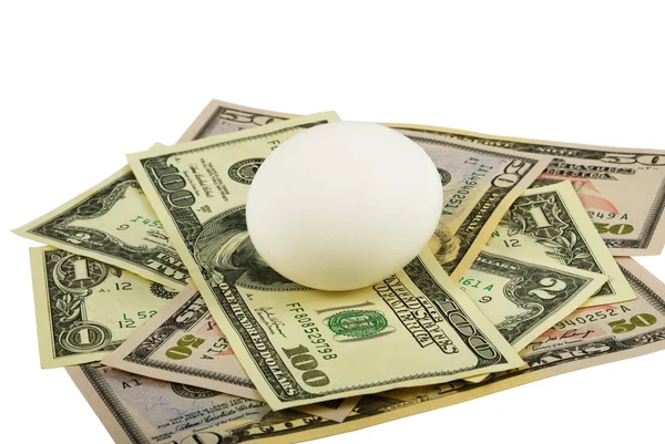 Dolar ve beyaz yumurta — Stok fotoğraf