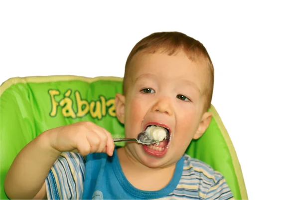 A kisfiú zabkását eszik. — Stock Fotó