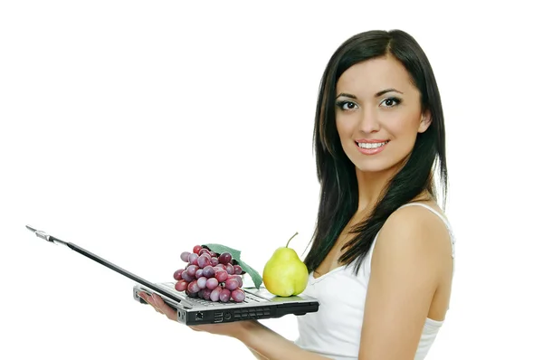Girl with laptop and fruits — Stock Photo, Image