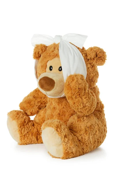 Teddybeer met kiespijn Stockfoto