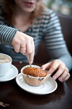 Woman eating at a café