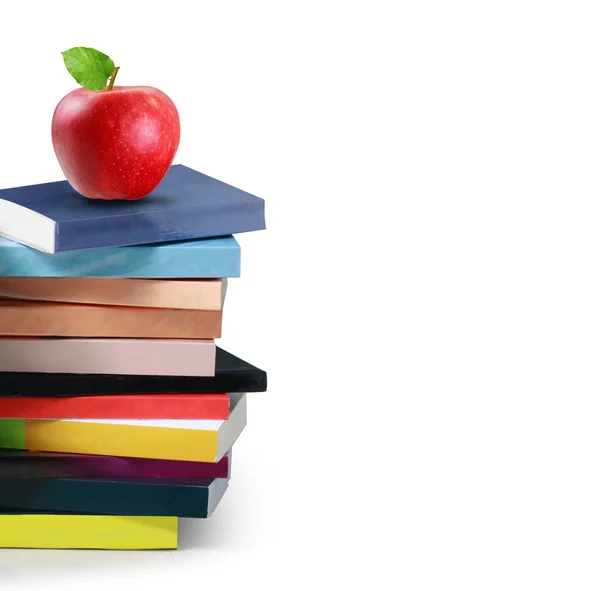 Knihy a červené jablko — Stock fotografie