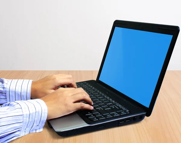 Hands on a laptop — Stock Photo, Image