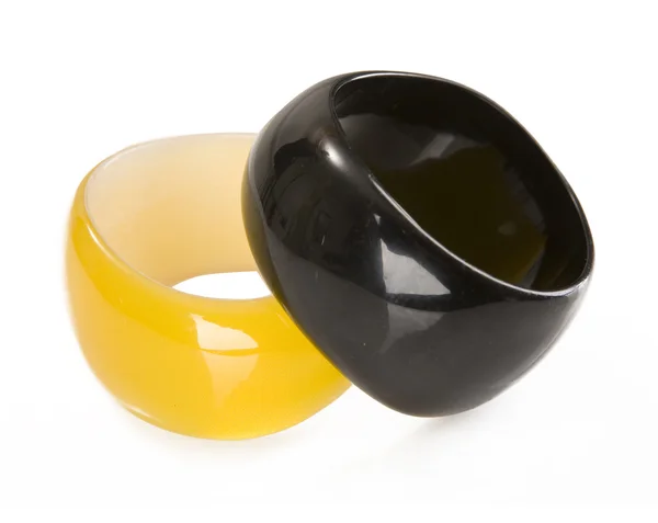 Yellow and black round plastic bracelet — Stock Photo, Image