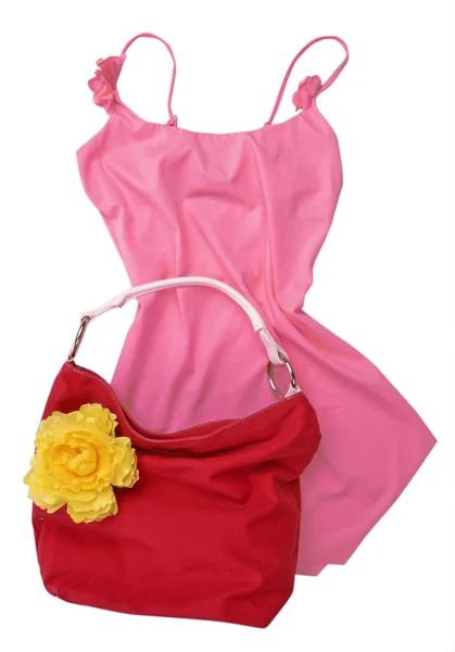 Růžové šaty košile halenka a žluté pytle — Stock fotografie
