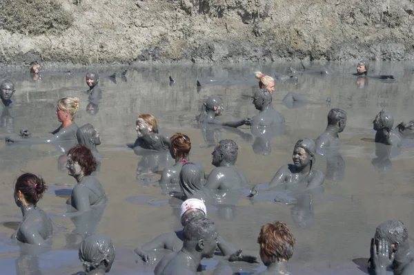 Feast of the gifts of nature, take curative mud in the mud volcano. — Stock Photo, Image