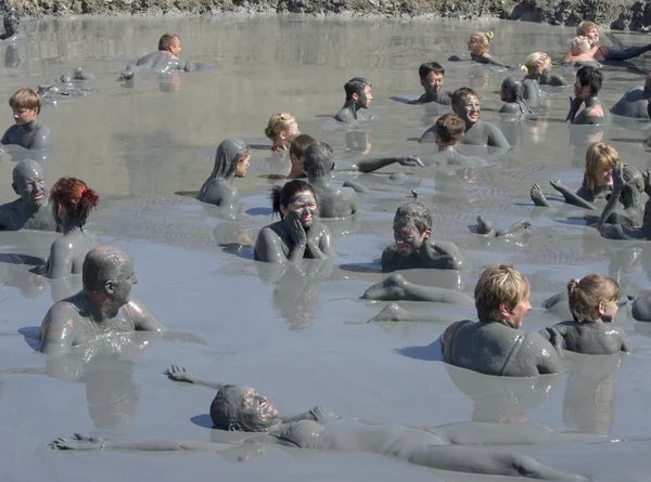 stock image Feast of the gifts of nature, take curative mud in the mud volcano.