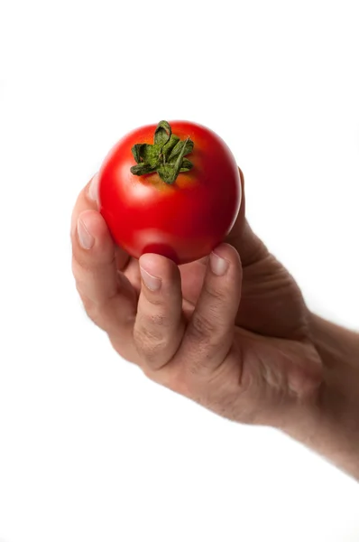 Mann mit Tomate in der Hand — Stockfoto