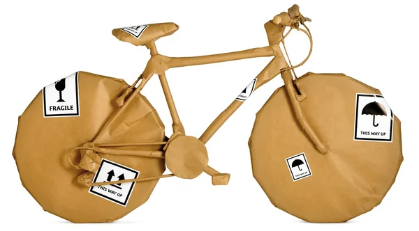 stock image Bicycle wrapped in brown paper ready for an office move isolate