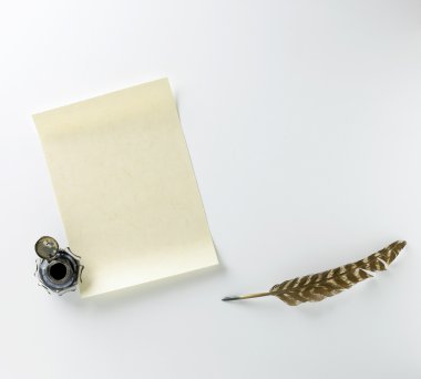 Parchment paper quill and ink pot with space for your copy or te clipart