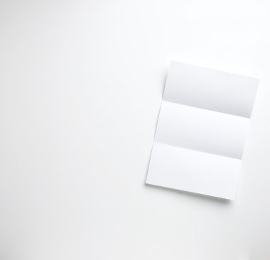 Sheet of blank a4 folded letter paper copyspace on a white backg clipart