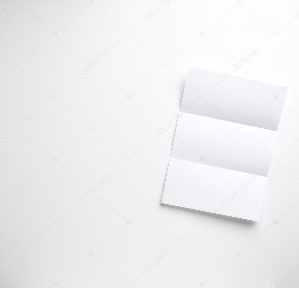 Sheet of blank a4 folded letter paper copyspace on a white backg
