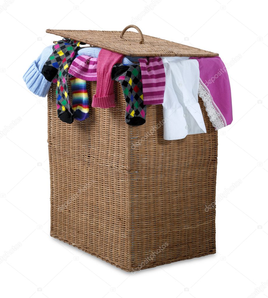 Overflowing wicker laundry basket isolated with clipping path