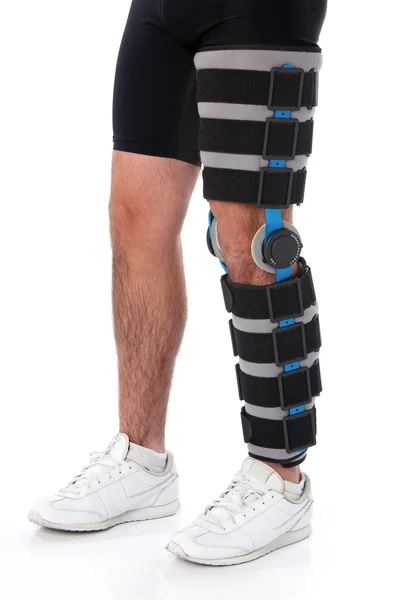Man wearing a leg brace — Stock Photo, Image