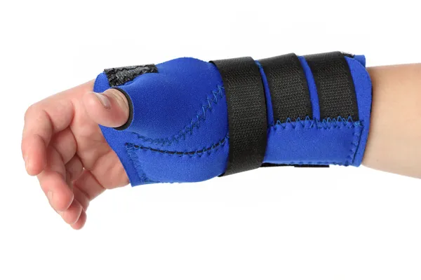 Human hand with a wrist brace — Stock Photo, Image