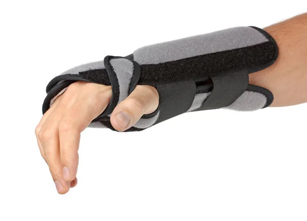 Human hand with a wrist brace Stock Picture