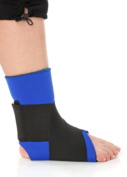 Foot with an ankle brace Stock Photo