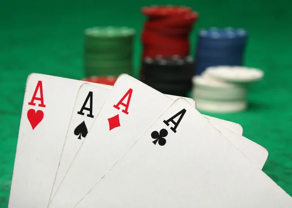 Four aces with gambling chips — Stock Photo, Image