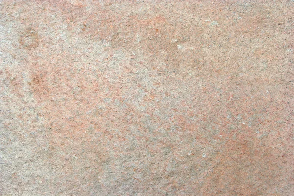 Текстурированный камень с оксидом цветов — стоковое фото
