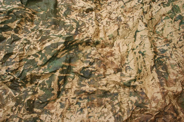 Papel dobrado de camuflagem — Fotografia de Stock