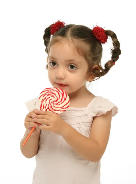 Bir lolipop farklı ifadelerle holding toddler — Stok fotoğraf