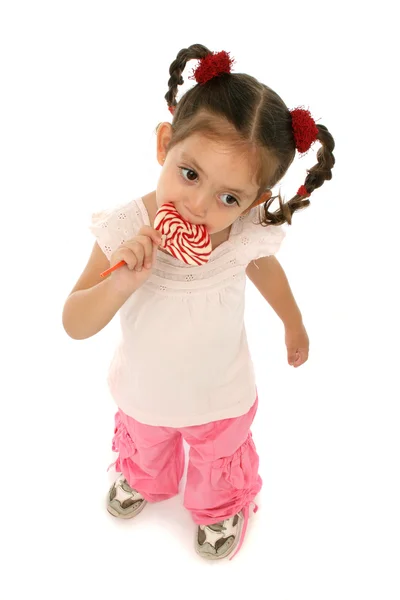 Toddler держит lollypop с различными выражениями — стоковое фото