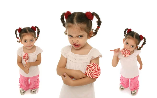 Criança segurando um pirulito com expressões diferentes — Fotografia de Stock