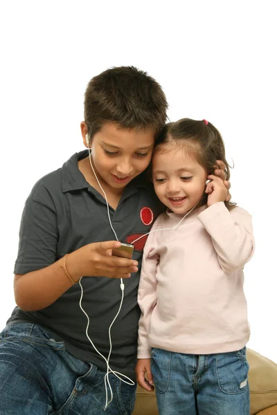 Children enjoying a mp4 player together — Stock Photo, Image