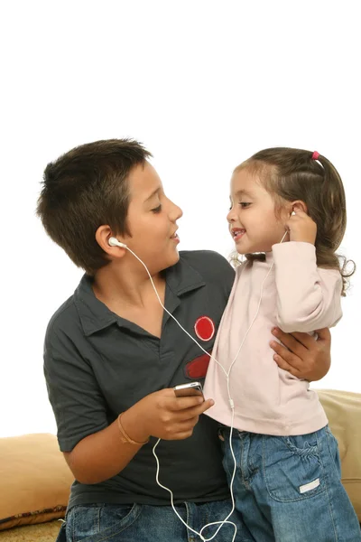 Children enjoying a mp4 player together — Stock Photo, Image
