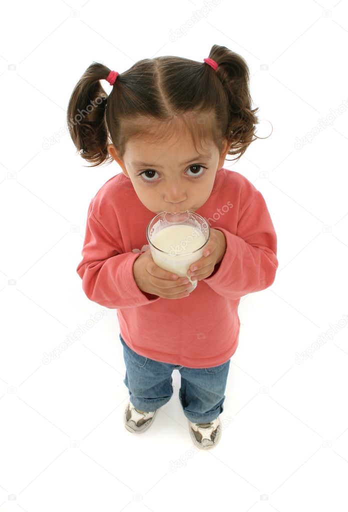 Cute little girl drinking milk