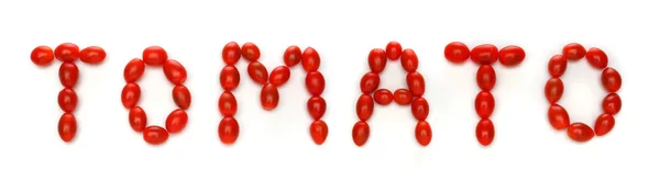 Wort Tomate geschrieben mit Kirschtomaten — Stockfoto