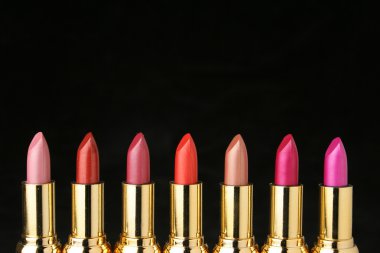 Several lipsticks for make up clipart
