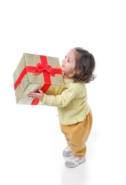 Тоддлер с рождественским подарком — стоковое фото