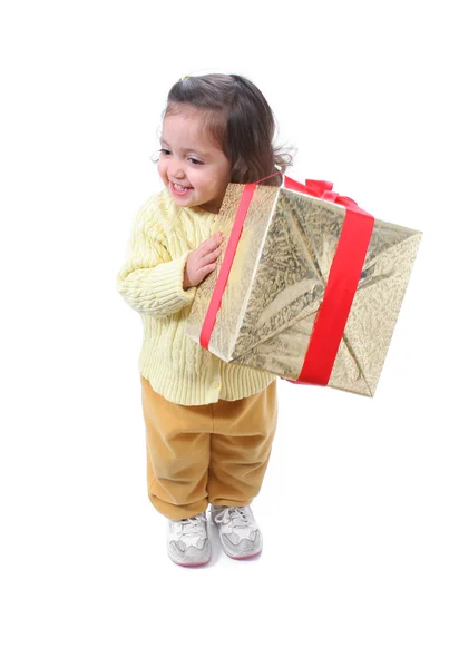 Niño pequeño con un regalo de Navidad —  Fotos de Stock
