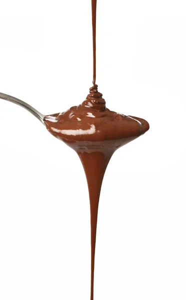 Cioccolato fuso su un cucchiaio — Foto Stock
