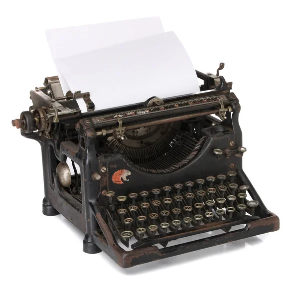 Alte Schreibmaschine mit leerem Papier — Stockfoto