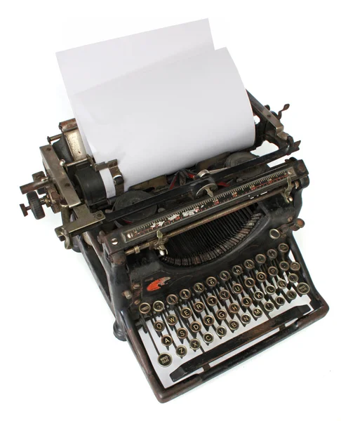 Old typewriter with a blank paper — Stock Photo, Image